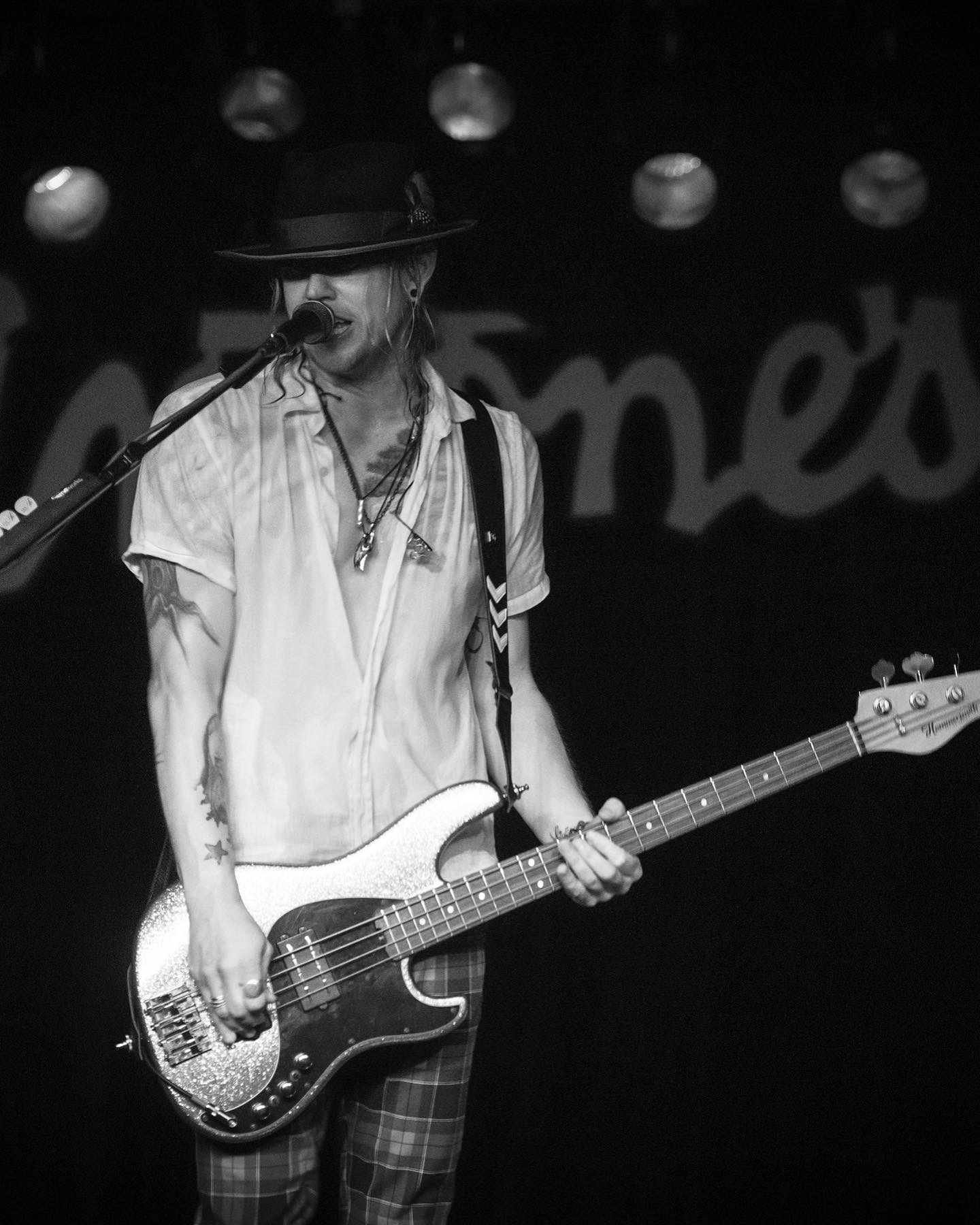 Bassist performing in black and white