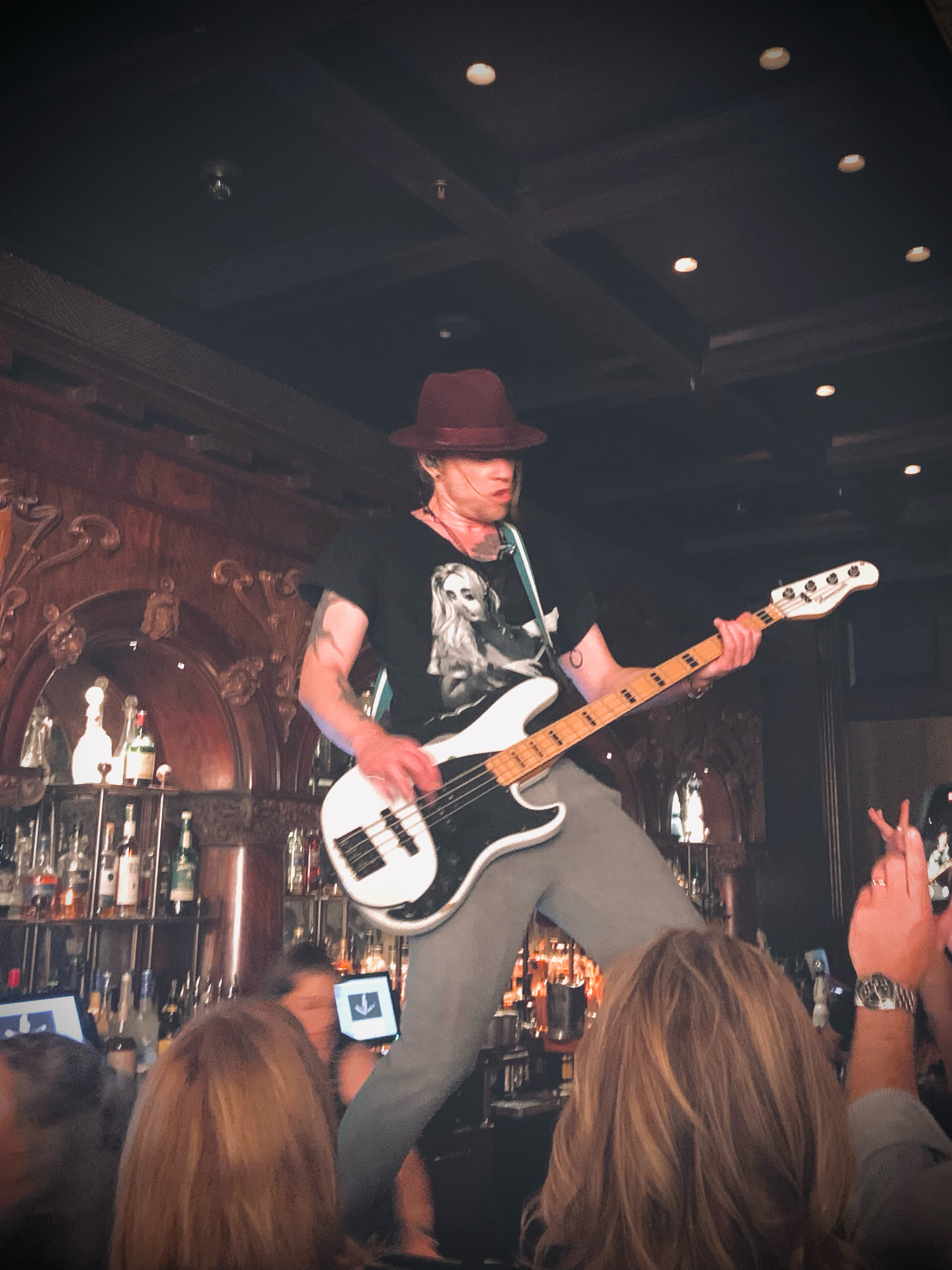 Bassist performing on the bar